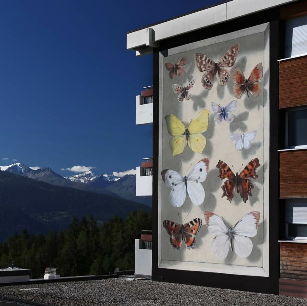 La collection du Valais, Cransmontana, Switzerland | Butterfly mural by street artist Mantra